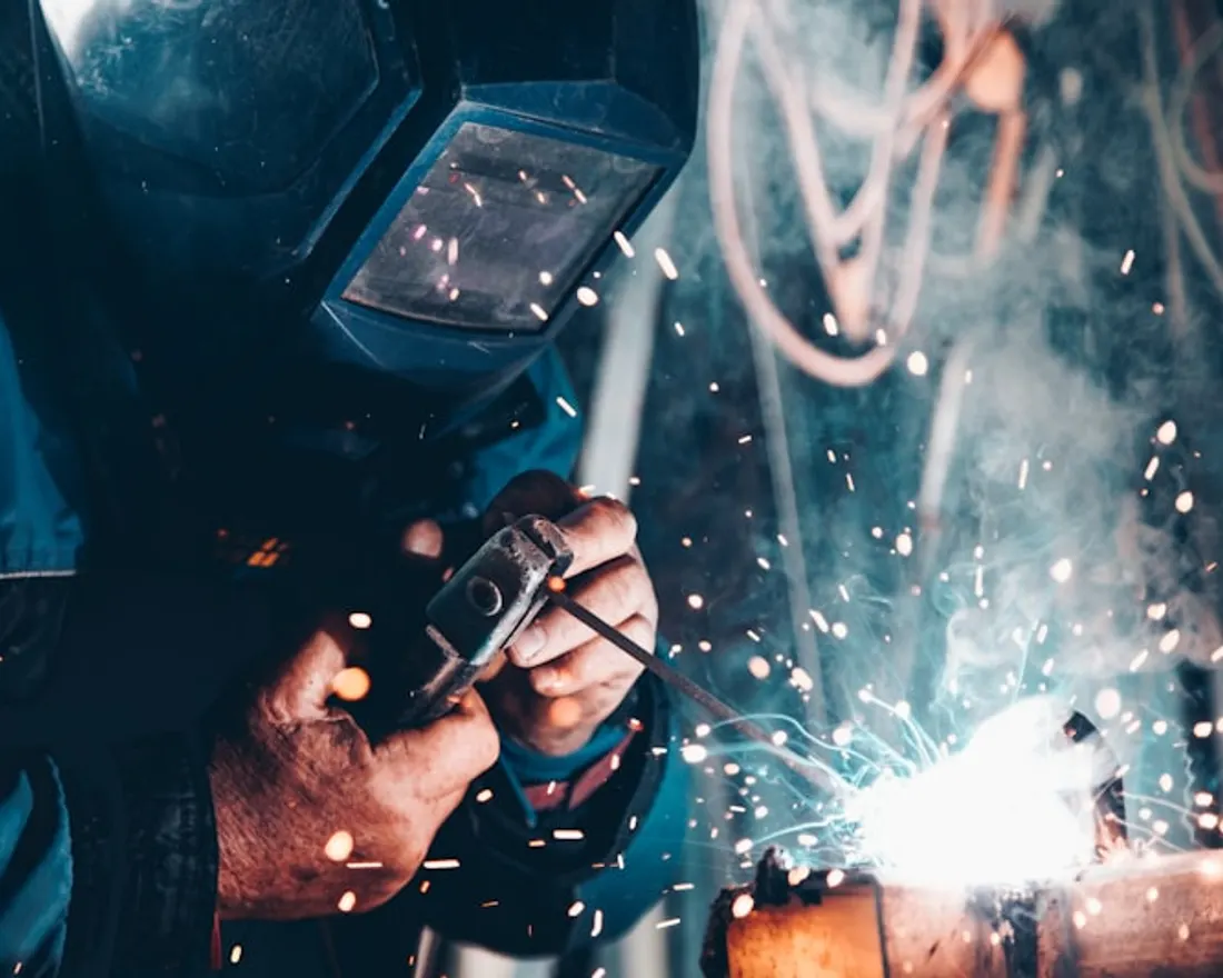 Welding work on an industrial site, the kind of operation ISO 45001 governs